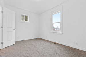 Unfurnished room with carpet flooring