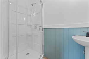 Bathroom with a shower with door