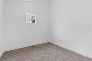 Unfurnished room featuring carpet floors