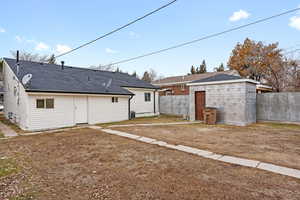 Back of property with a garage