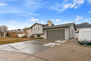 View of front facade featuring a garage