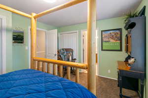 Bedroom featuring a closet and carpet flooring