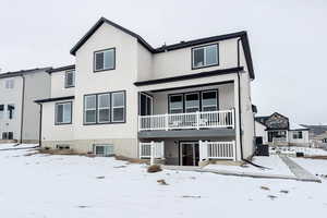 Snow covered house featuring central air condition unit