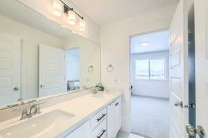 Bathroom with vanity and a textured ceiling