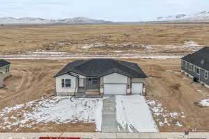 Snowy aerial view featuring a mountain view