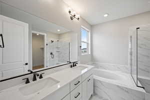 Bathroom with plus walk in shower and vanity