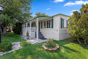 View of front of property with a front lawn