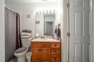 Bathroom featuring vanity and toilet