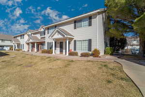 View of front facade with a front yard