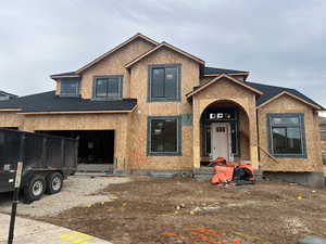 Property under construction with a garage