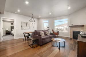 Living room featuring a mountain view, wood-type flooring, and a tile fireplace