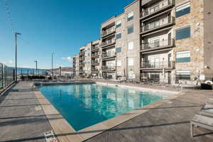 View of swimming pool with a patio area