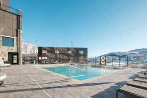 View of pool featuring a mountain view and a patio area