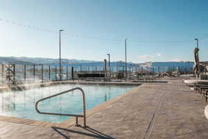 View of swimming pool with a mountain view