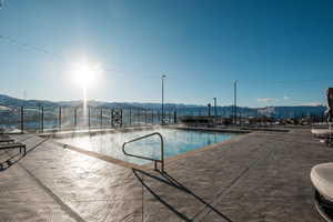 View of pool featuring a mountain view and a patio area