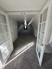 View into large bedroom with french doors