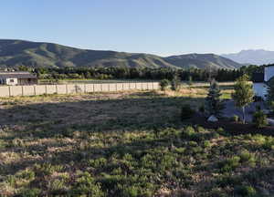 Property view of mountains with a rural view