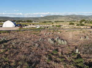 Property view of mountains featuring a rural view