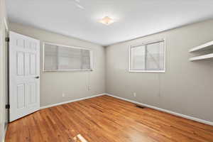 Unfurnished room with light hardwood / wood-style flooring