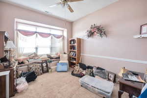 Misc room featuring ceiling fan and carpet flooring