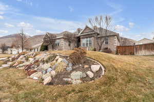 Exterior space with a mountain view and a front yard