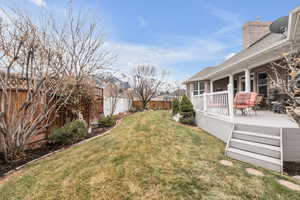 View of yard with a wooden deck