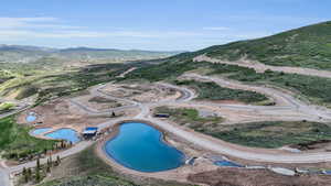 Bird's eye view featuring a water and mountain view