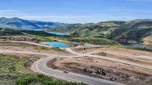 Drone / aerial view with a water and mountain view