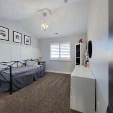 Bedroom 2 with vaulted ceiling.