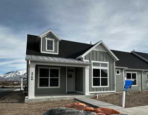 View of front of house featuring a porch and a mountain view