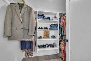 Walk in closet featuring carpet flooring