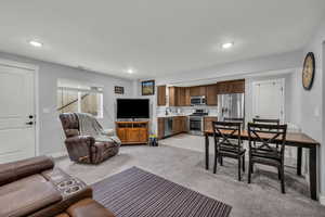 Basement MIL apartment featuring light carpet