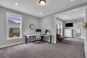 View of carpeted office/sitting room in primary bedroom