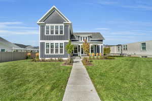 View of front of house with a front lawn