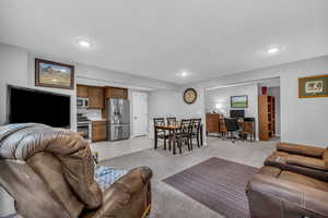 Basement MIL apartment featuring light carpet