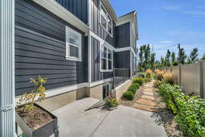 View of side of home with walkout for basement MIL apartment