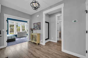 Interior space featuring a chandelier and LVP flooring