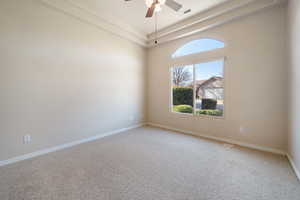 Carpeted empty room with ceiling fan