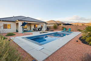 View of swimming pool featuring a patio and a mountain view