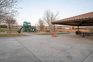 Playground at dusk featuring a gazebo