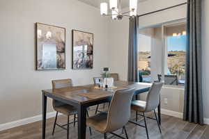 Dining space featuring a notable chandelier