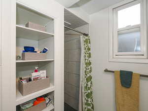 Bathroom featuring a shower with curtain