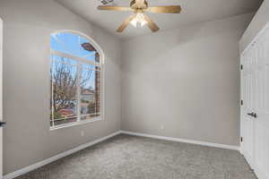 Unfurnished bedroom with carpet floors, a closet, and ceiling fan