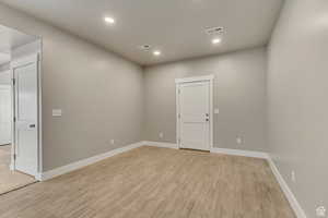 Spare room with light hardwood / wood-style floors