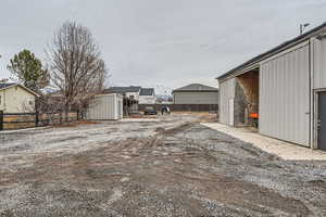 View of yard featuring a storage unit