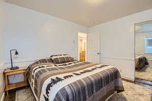 Bedroom with hardwood / wood-style flooring