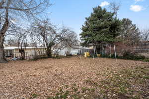 View of yard featuring a playground