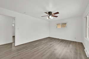 Spare room with ceiling fan and light wood-type flooring