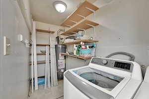 Clothes washing area with washer and dryer and water heater