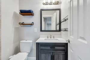 Bathroom featuring vanity and toilet